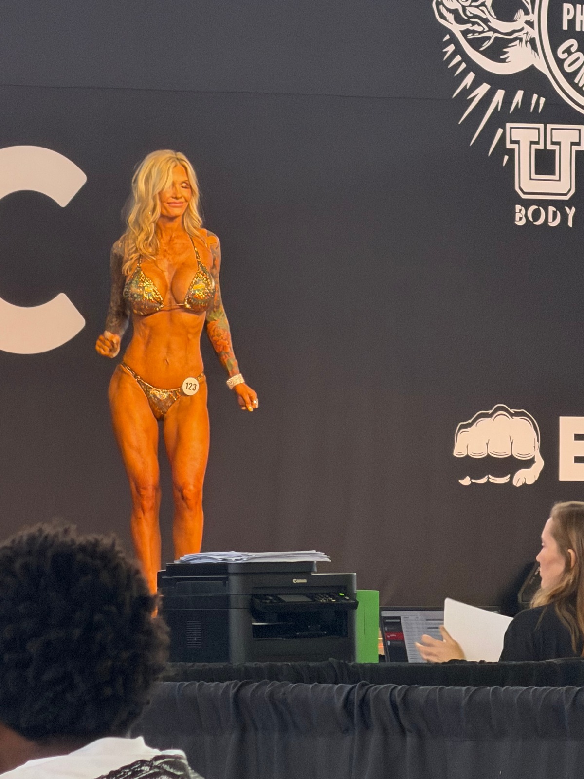 Bikini competitor displaying a deep stage spray tan