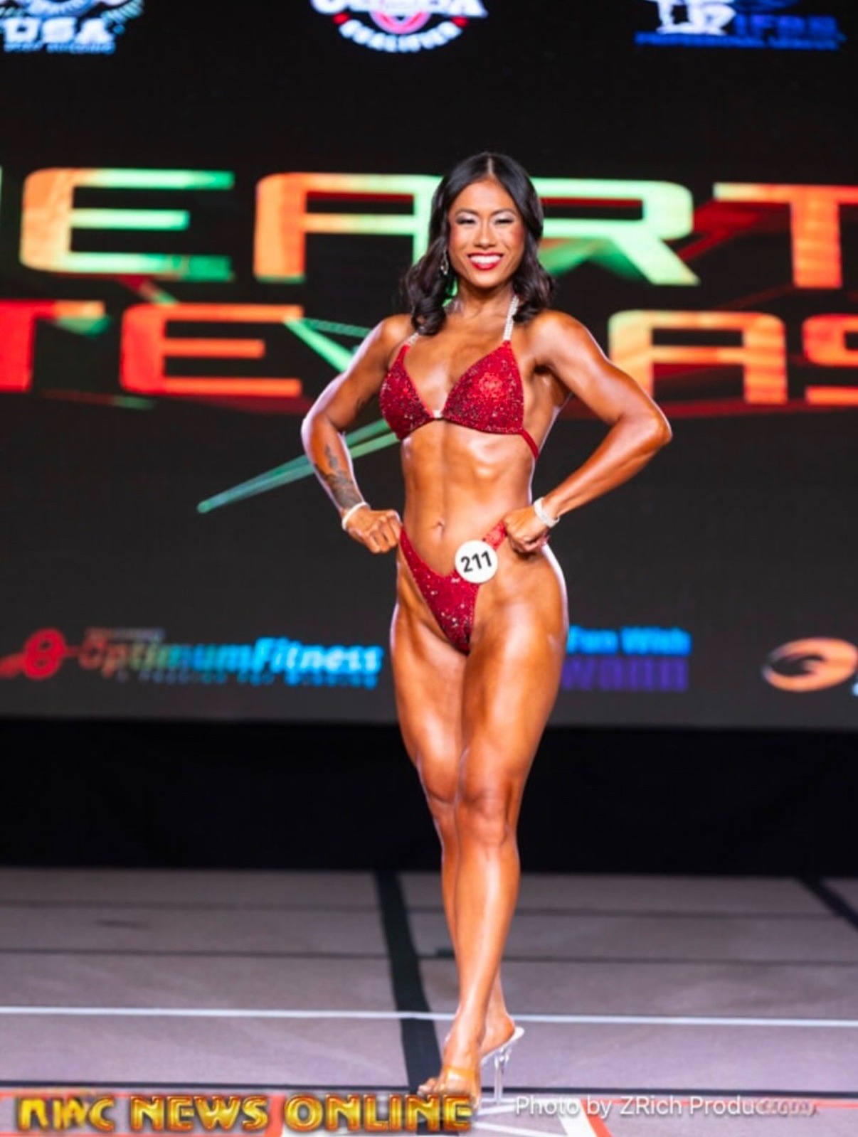 Bikini competitor posing on stage with Bronzed Bay Tan color