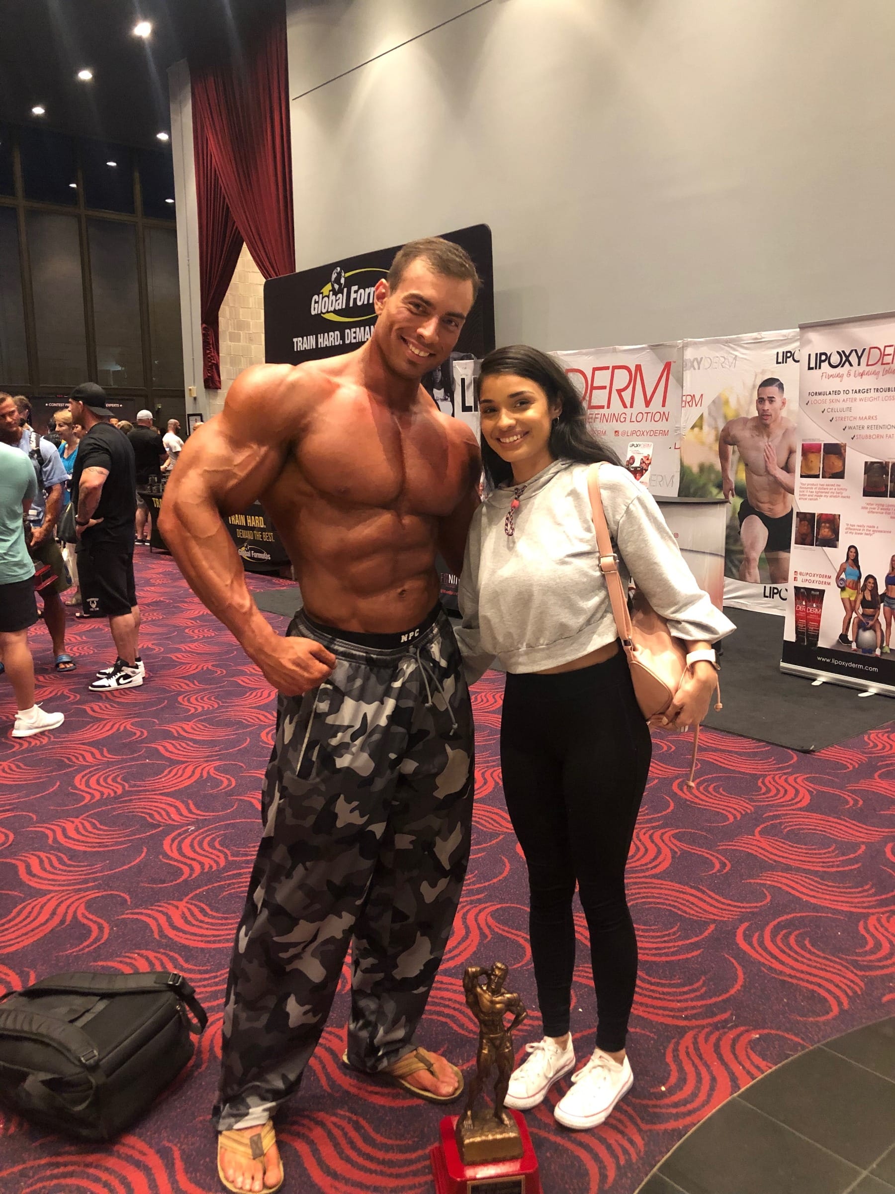 Bronzed Bay Tan client at a bodybuilding competition event
