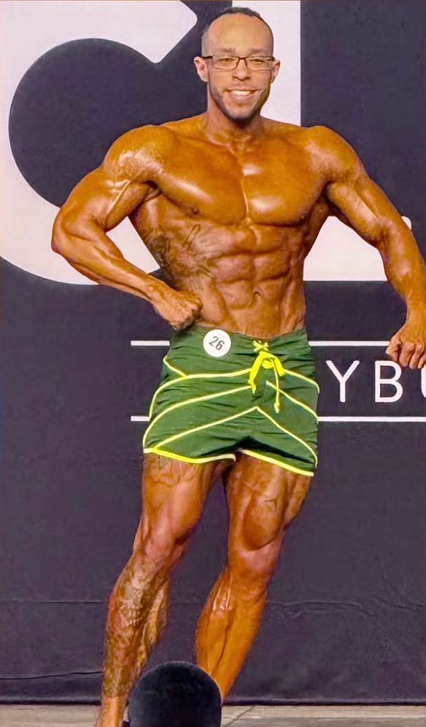 Male bodybuilding athlete with competition spray tan color